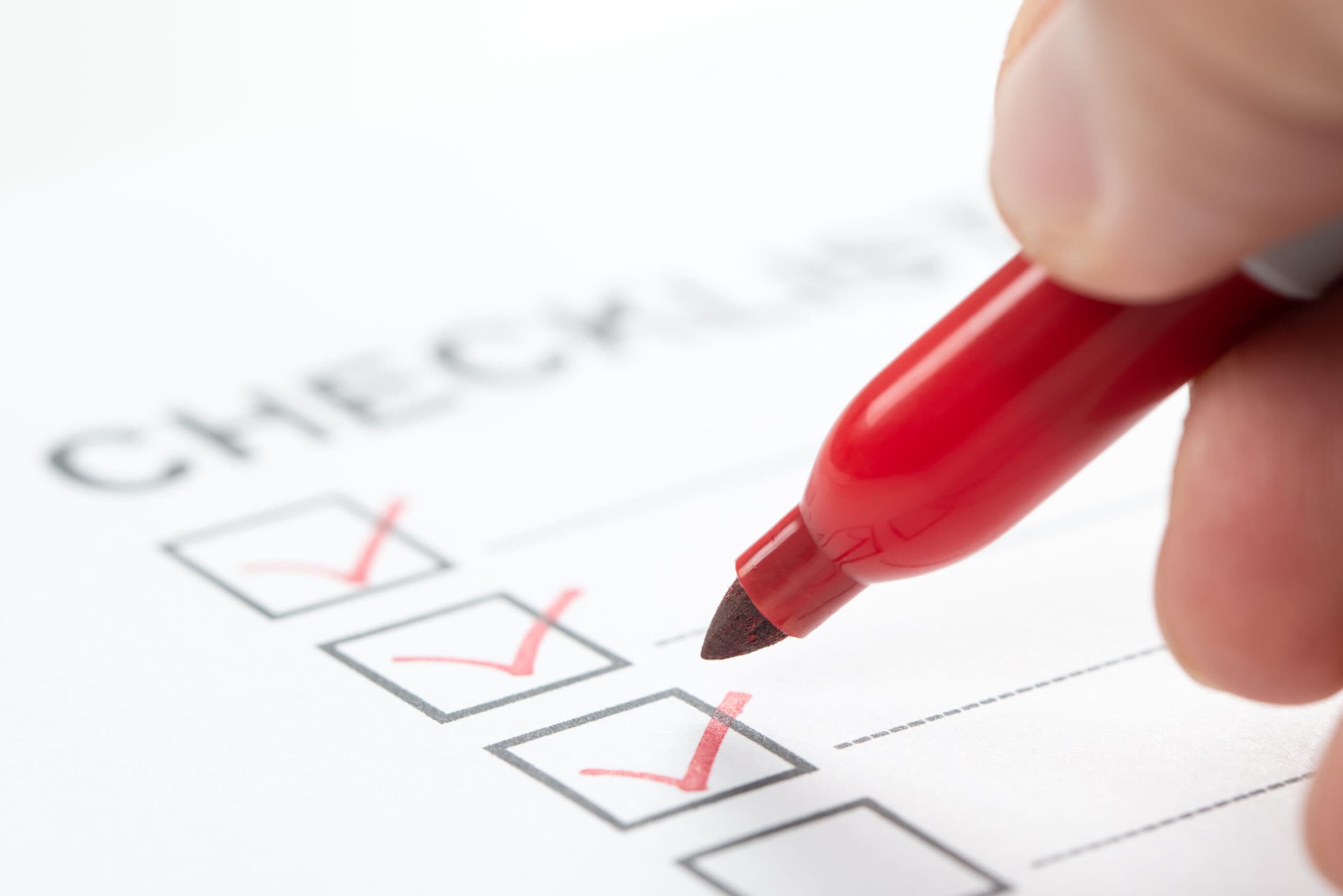 hand-with-red-marker-pen-marking-on-checklist-box-2024-12-13-17-08-01-utc-scaled
