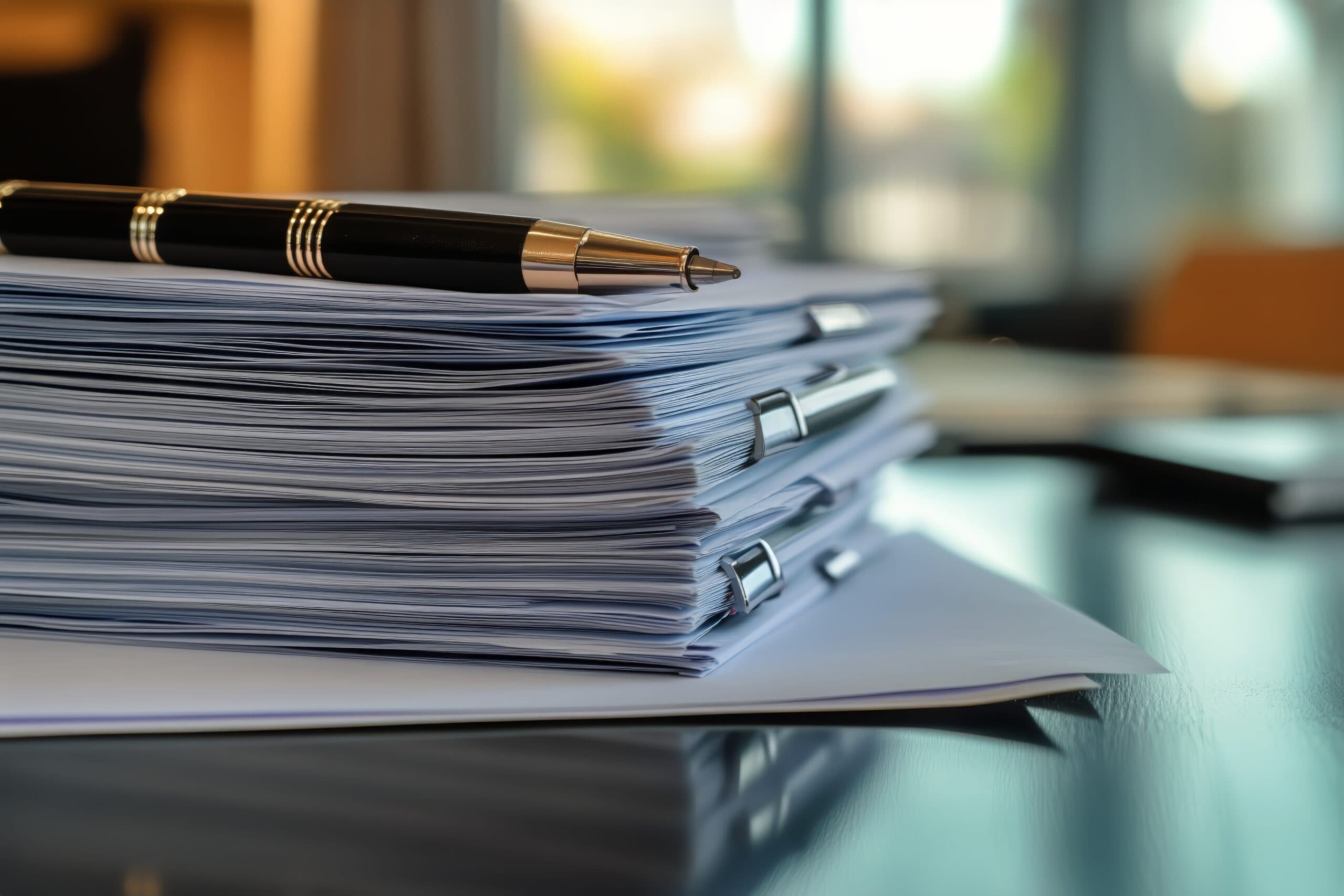 vecteezy_documents-organized-on-table-with-pen-and-potted-plant-in_70165293-scaled